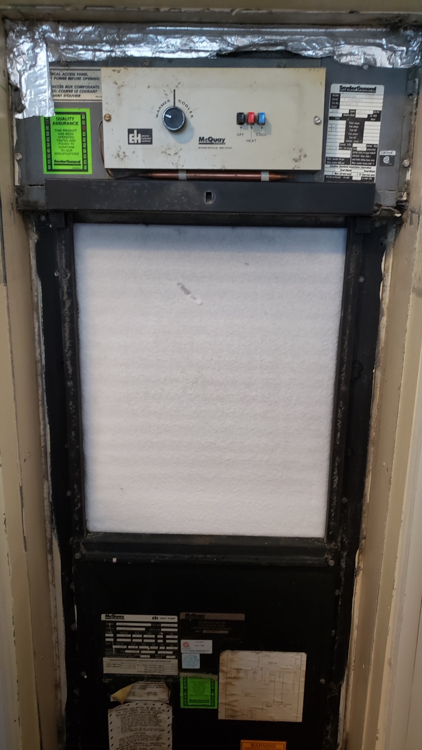 Accessible filter on a vertical condo heat pump, shown for HTS Toronto maintenance guidance