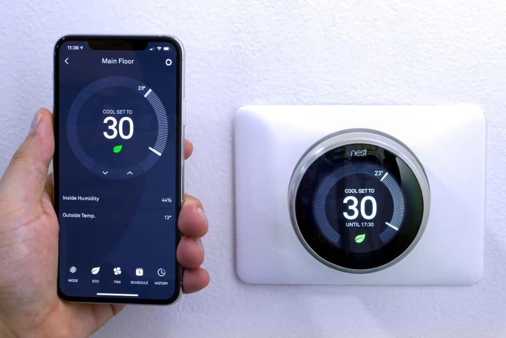 Nest Thermostat Synced with a Phone in a Condo Unit
