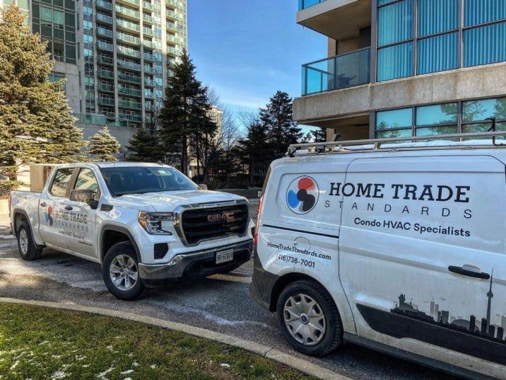 Home Trade Standards Fan Coil Retrofit Trucks Outside of a Condo Building in Mississauga