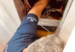 Home Trade Standards HVAC Technician Repairing a Fan Coil Unit